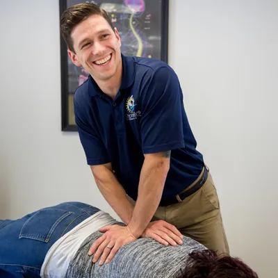 Chiropractor Milford CT CJ Cameron Adjusting Patient Appointment